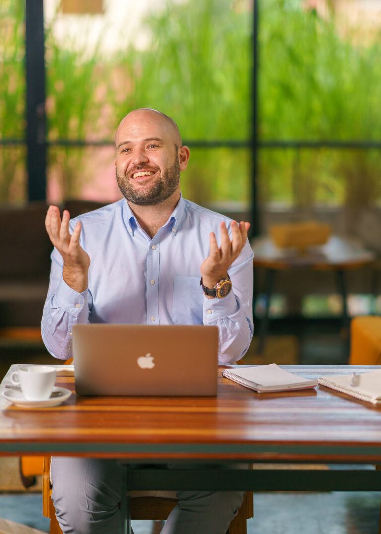 Headshot photography of a business owner in his office